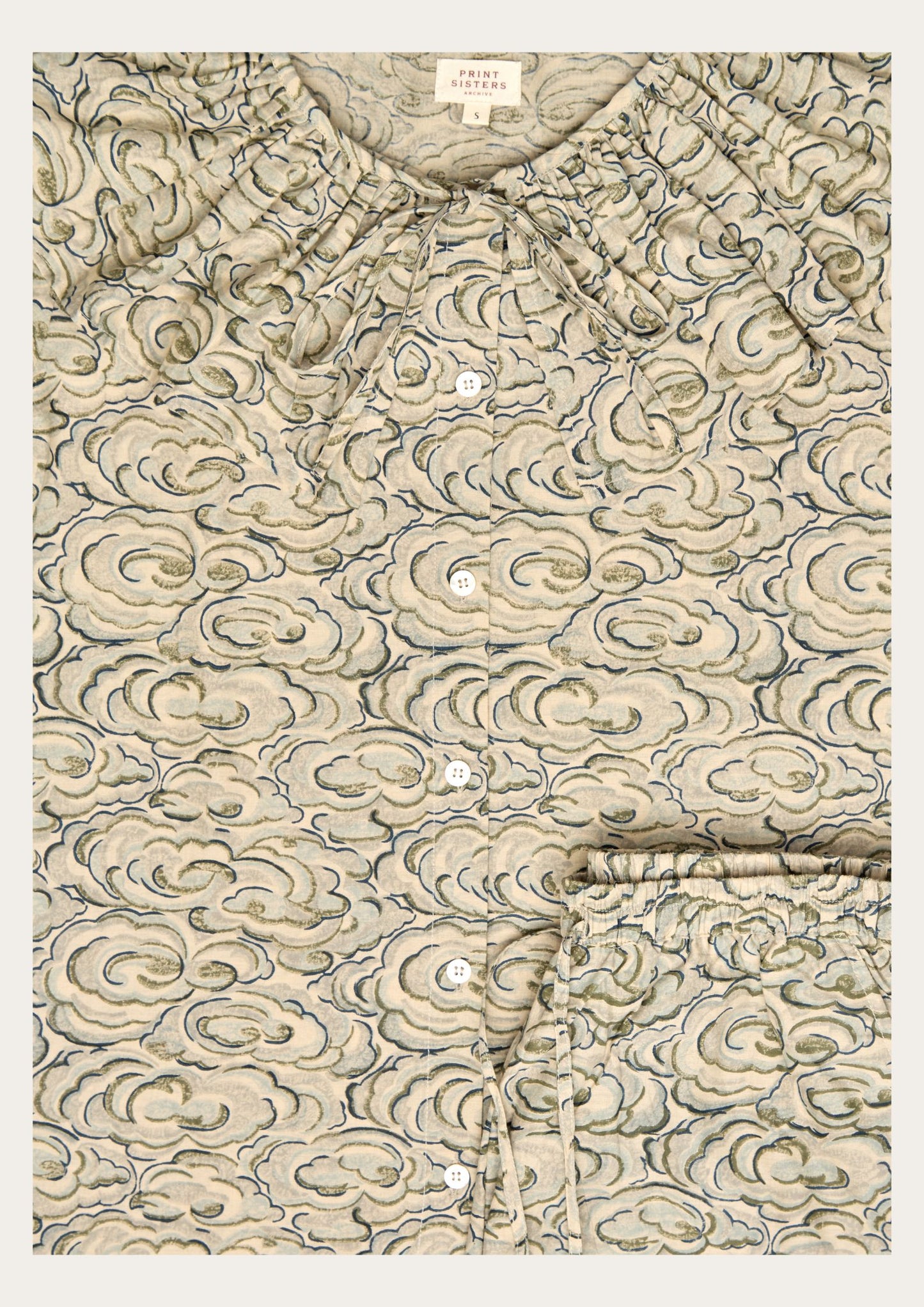 long - sleeve shirt and trousers with a kumo clouds pattern on a white background