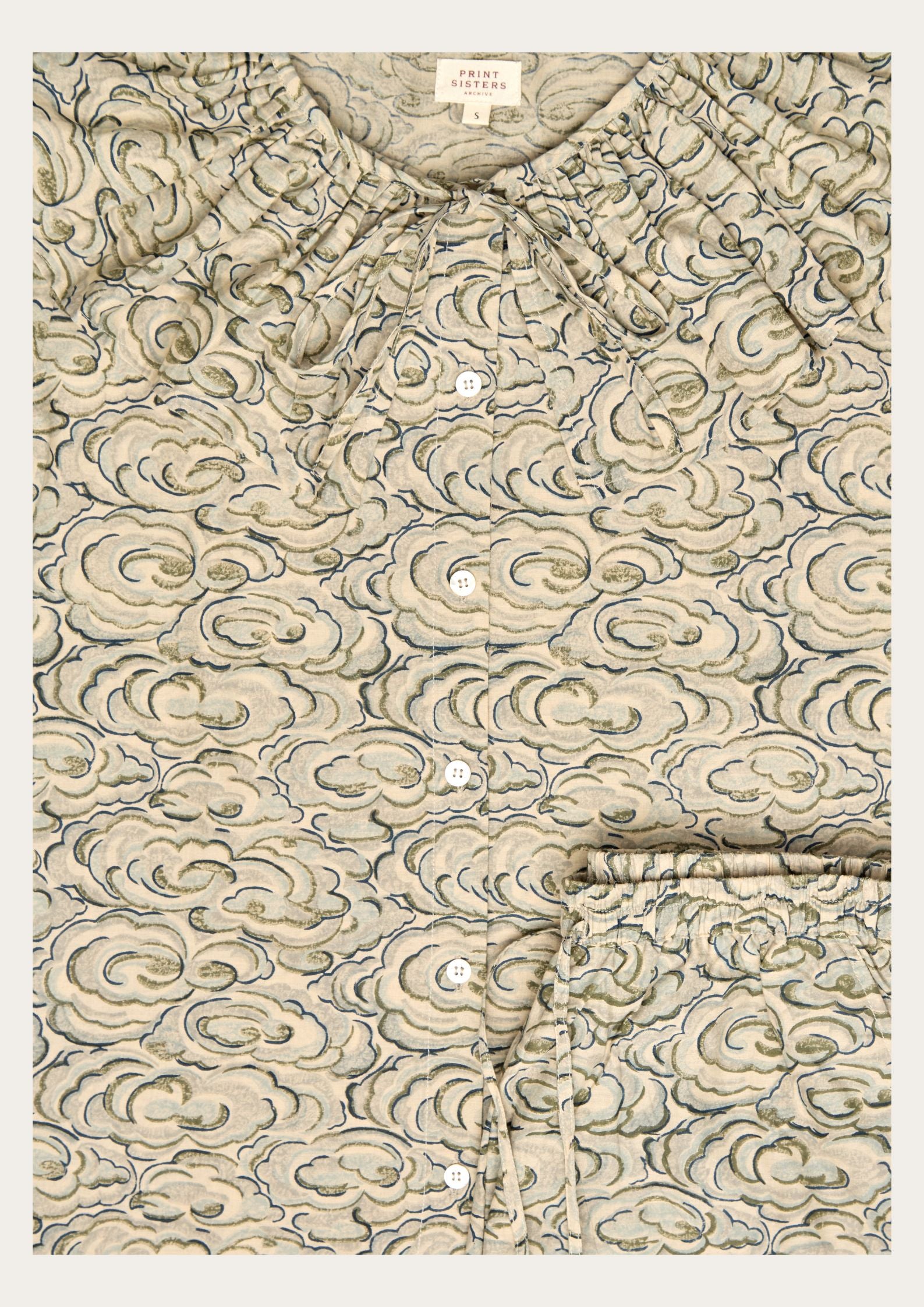 long - sleeve shirt and trousers with a kumo clouds pattern on a white background