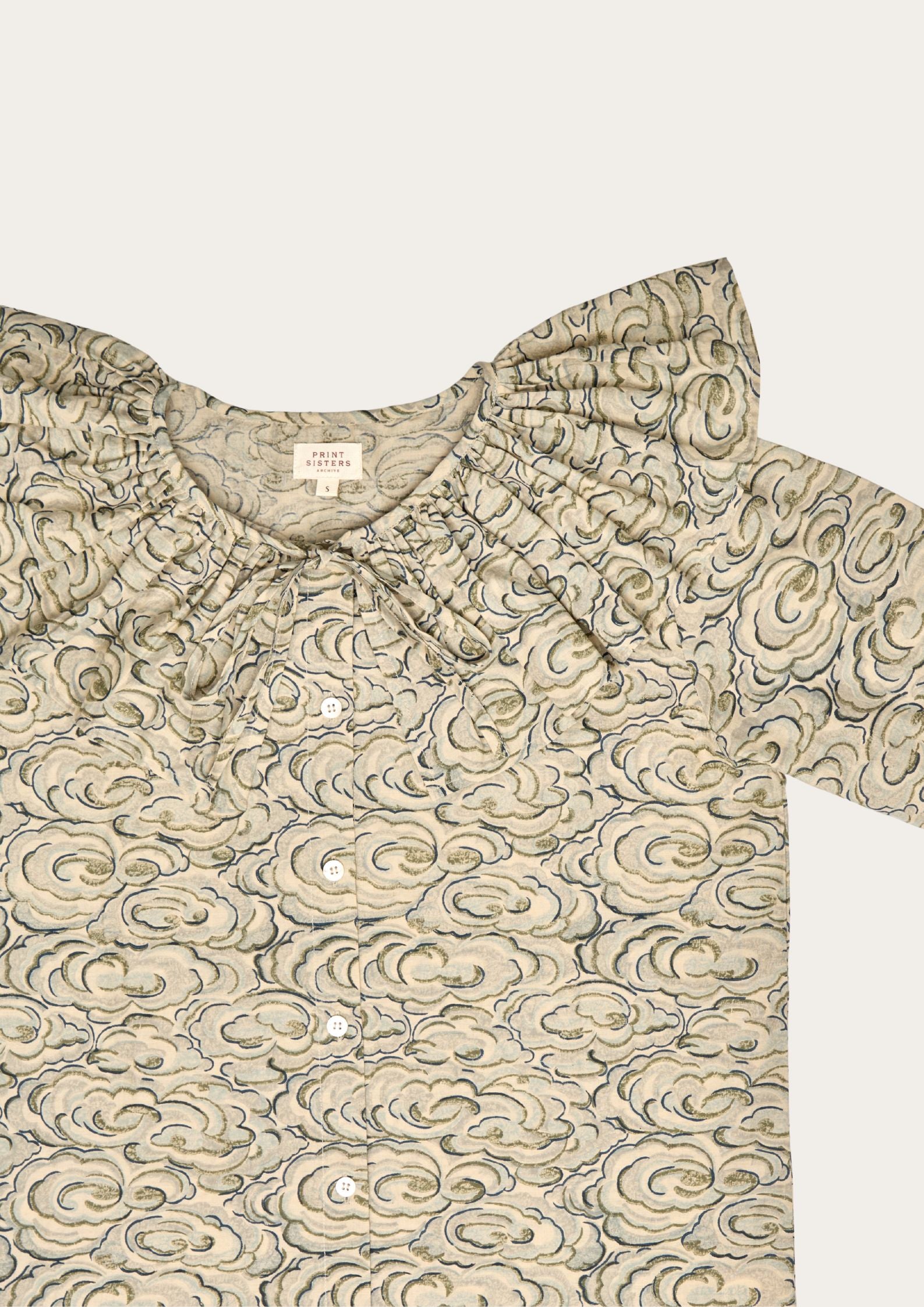 long - sleeve shirt with a kumo clouds pattern on a white background